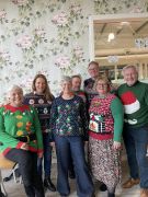 Greenfingers Fundraising Committee gets into the Most Jumperful spirit.